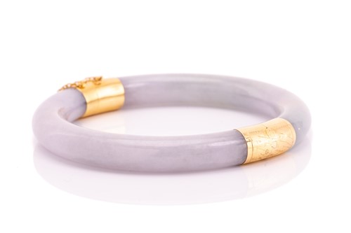 Lot 53 - A green and lavender jadeite hinged bangle,...