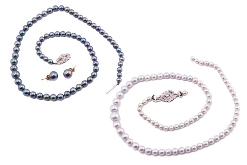 Lot 15 - Two pearl necklaces, comprising a single...