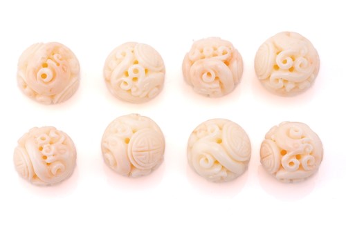 Lot 190 - Eight Chinese carved coral beads, the 21.2 mm...