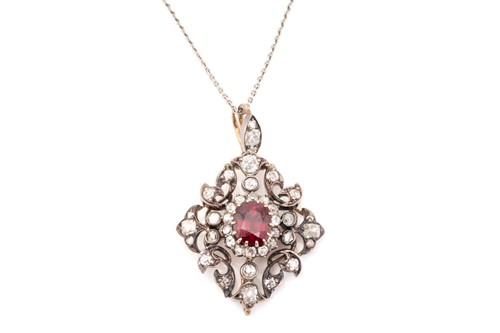 Lot 55 - A ruby and diamond pendant on chain, of...