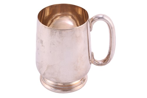 Lot 500 - A silver pint tankard; tapering cylindrical...