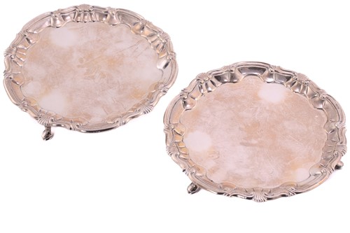 Lot 504 - A pair of George II silver waiters; circular...