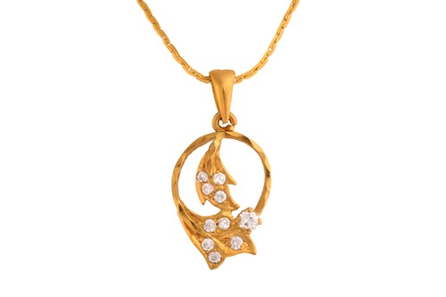 Lot 19 - A gem-set pendant on chain, of foliate design,...