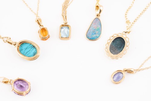 Lot 170 - A group of seven gem-set pendants on chain;...