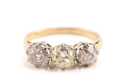 Lot 30 - An old-cut diamond trilogy ring, claw-set in...