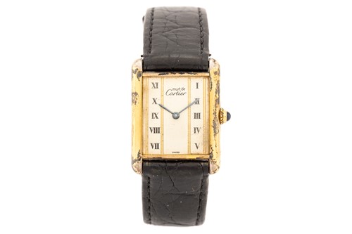 Lot 402 - A Must de Cartier silver gilt wristwatch; Tank...