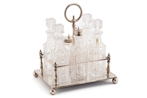 Lot 491 - A late Victorian silver six-bottle cruet stand,...