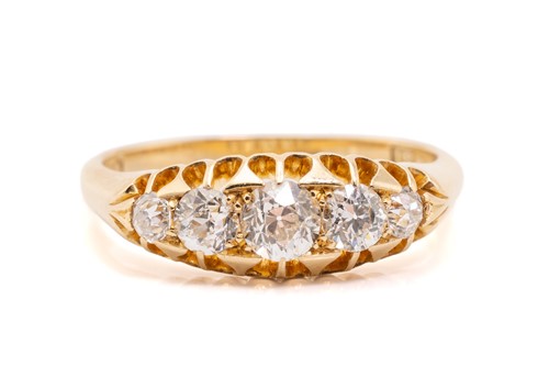 Lot 7 - A five-stone diamond half-hoop ring,...