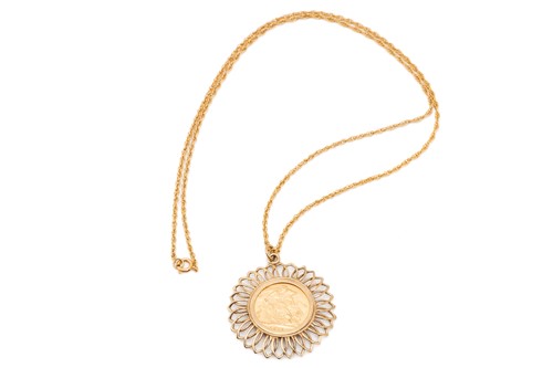 Lot 34 - A sovereign pendant on chain; the sovereign...