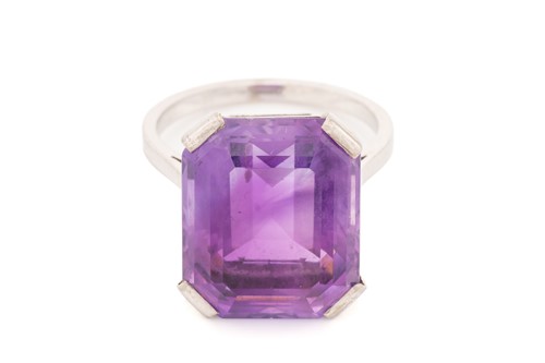 Lot 38 - An amethyst solitaire ring, featuring an...