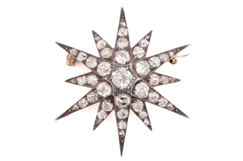 Lot 79 - A Victorian diamond starburst brooch, the...