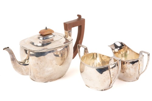Lot 486 - An early 20th-century three-piece silver tea...