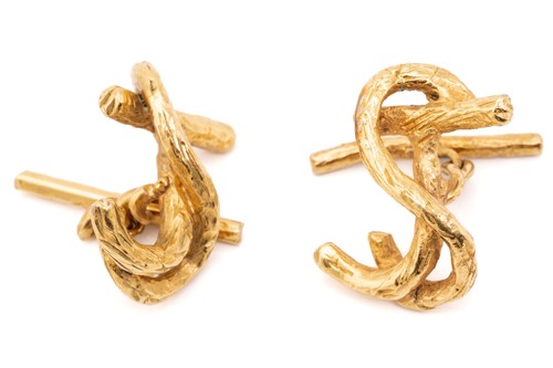 Lot 217 - A pair of yellow metal cypher cufflinks, each...