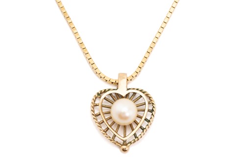 Lot 156 - A 9ct yellow gold heart pendant on chain, the...