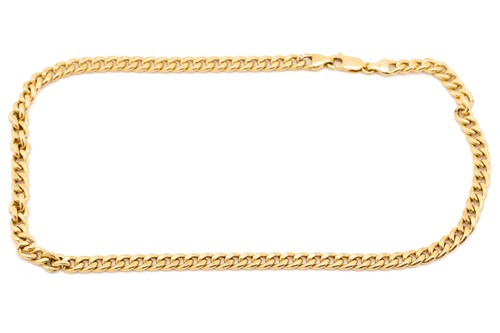 Lot 121 - A yellow metal flat curb link chain, fastens...