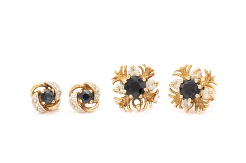 Lot 283 - A pair of sapphire and diamond stud earrings...