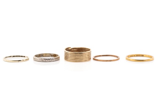 Lot 175 - Four gold rings and a platinum ring; including...