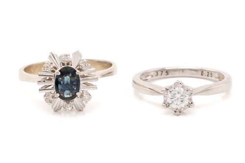 Lot 186 - A diamond solitaire ring and a sapphire dress...