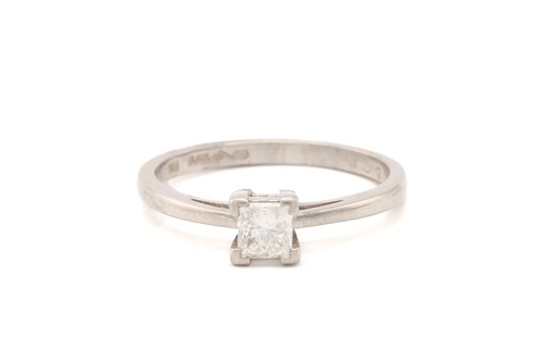 Lot 242 - A single-stone diamond ring, claw set with a...