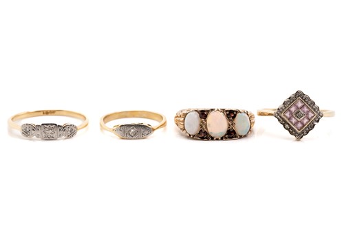 Lot 10 - Four gem-set dress rings, including an...