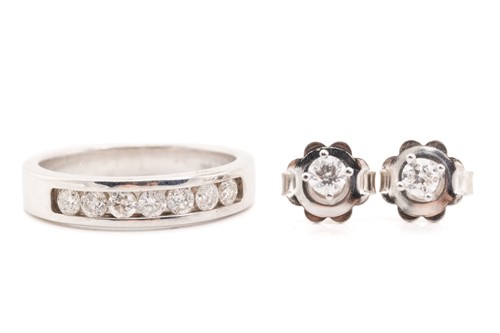 Lot 95 - A 9ct white gold seven stone diamond half hoop...