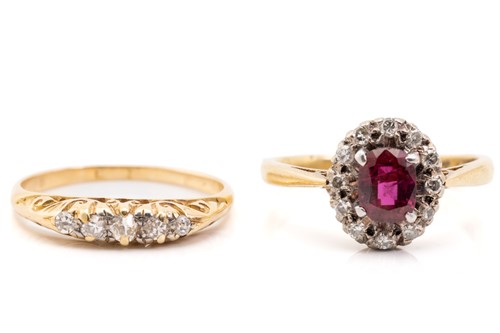 Lot 319 - A synthetic ruby and diamond cluster ring and...
