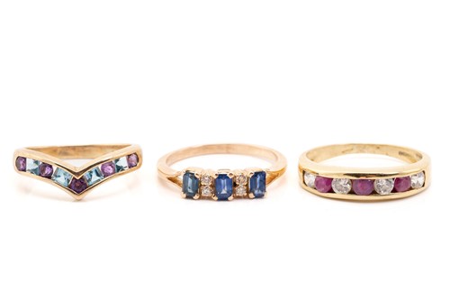 Lot 301 - An 18ct yellow gold channel=set seven stone...