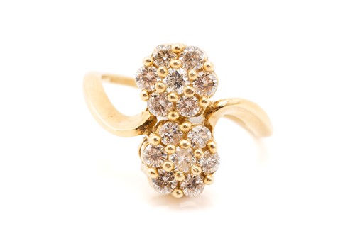 Lot 280 - A diamond crossover double cluster ring,...