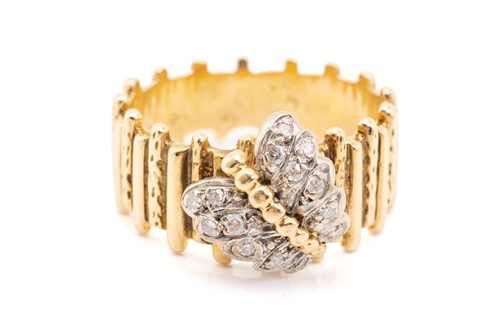 Lot 46 - A yellow metal and diamond ring, designed with...
