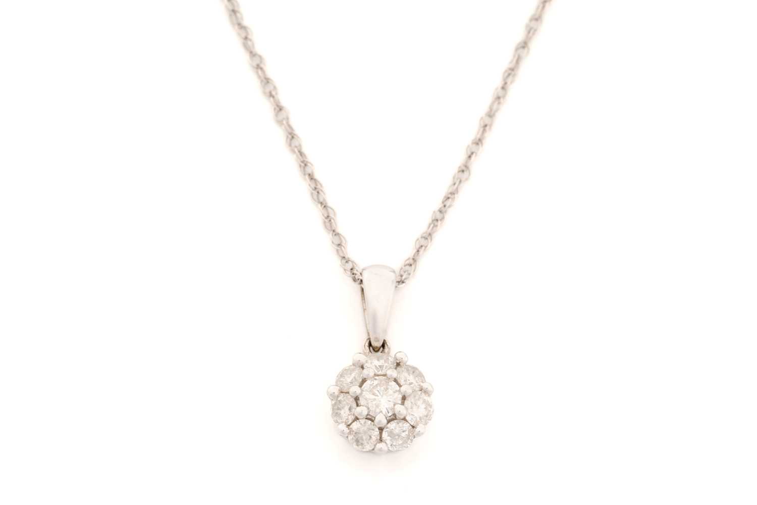 Lot 202 - A diamond set cluster pendant and chain,...