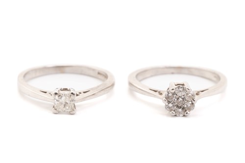 Lot 317 - Two diamond set rings; a seven stone cluster...