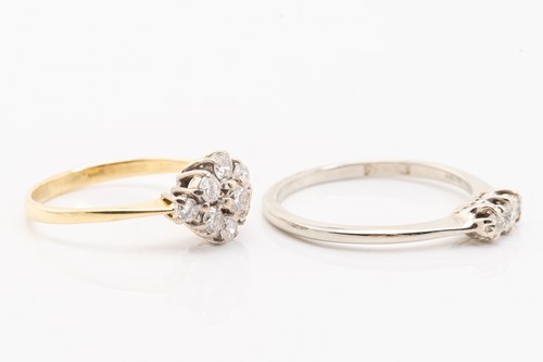 Lot 174 - Two diamond set rings, featuring a 9-stone...