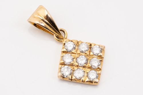 Lot 150 - An 18ct yellow gold, garnet, and diamond...