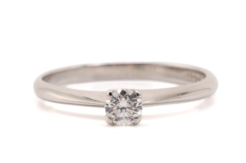 Lot 96 - A diamond solitaire ring in 18ct white gold,...