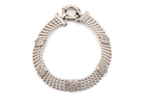 Lot 268 - A cubic zirconia heart bracelet in 9ct white...