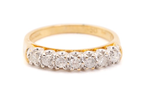 Lot 133 - A seven-stone half hoop diamond ring,...