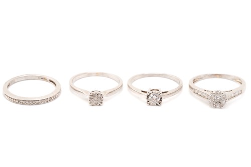 Lot 137 - A seven stone diamond cluster ring, to diamond...