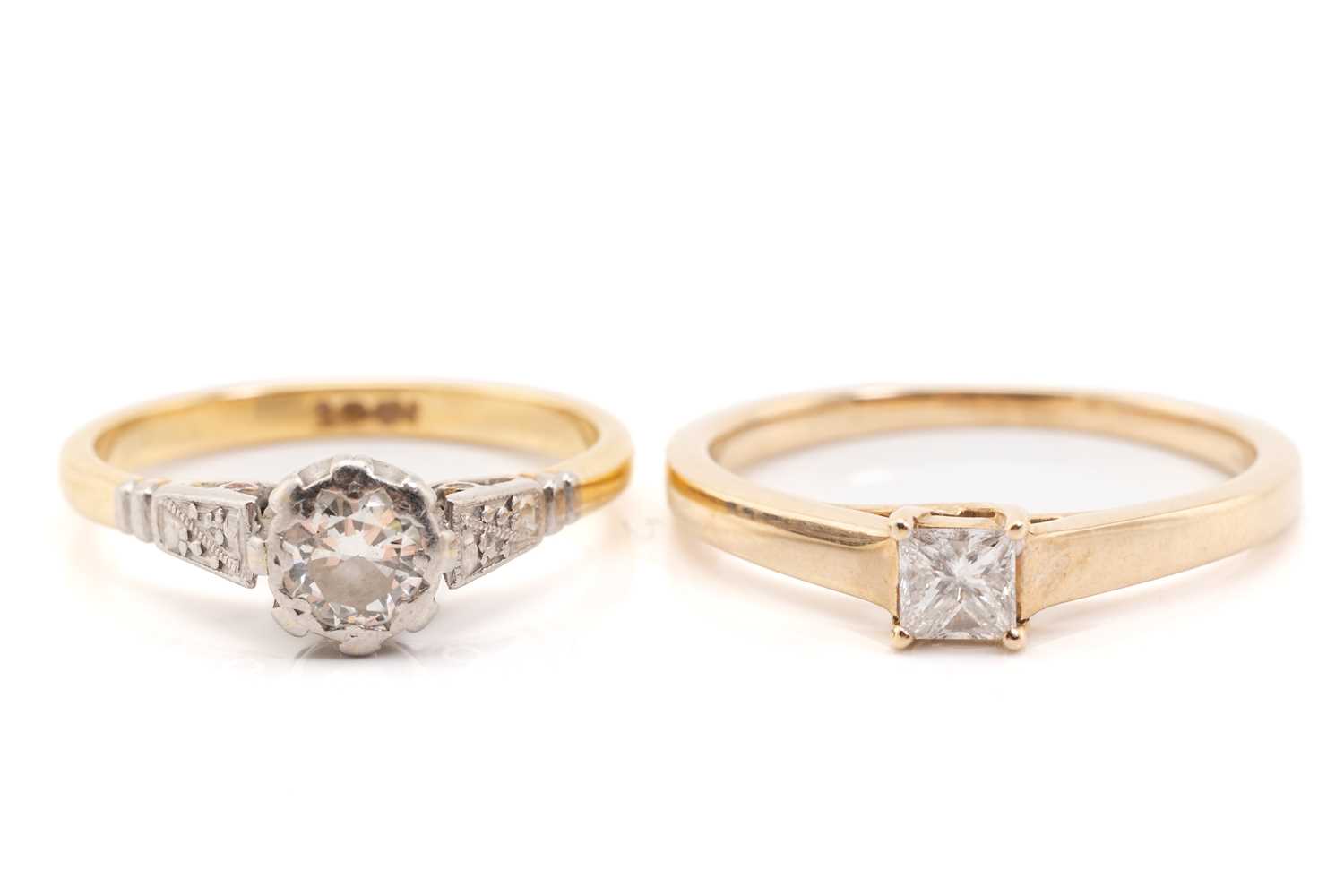 Lot 11 - Two single-stone diamond rings, the first...