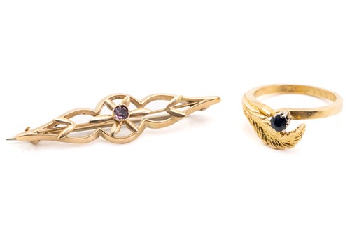 Lot 130 - An 18ct yellow gold bypass ring with leaf...