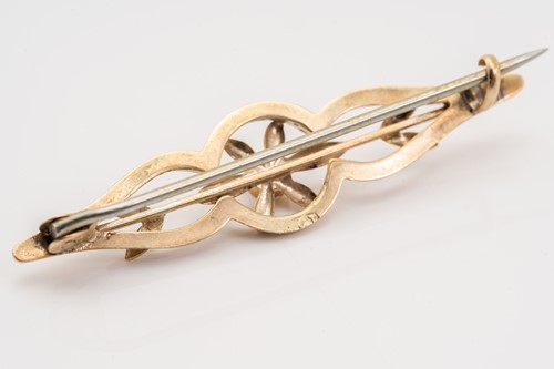 Lot 130 - An 18ct yellow gold bypass ring with leaf...