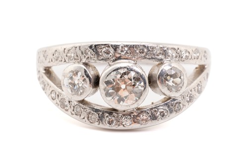 Lot 205 - A white metal bombe style diamond set ring,...