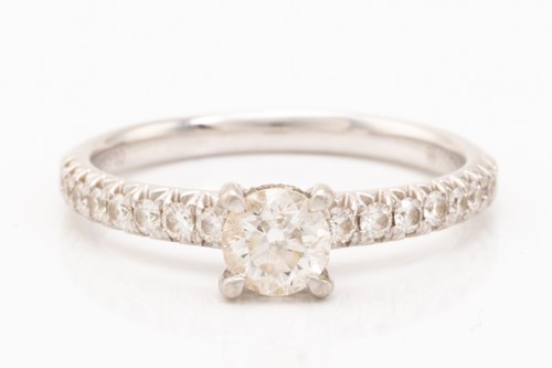Lot 85 - A diamond solitaire ring in platinum, centred...
