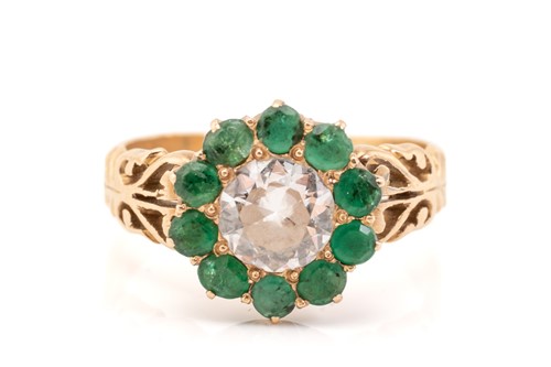 Lot 199 - A yellow metal, diamond and emerald cluster...