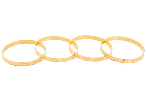 Lot 5 - A suite of four bangle bracelets, decorated in...