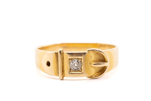 Lot 9 - An 18ct gold diamond-set ring, of buckle...
