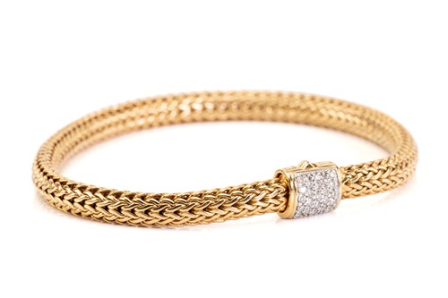Lot 88 - An 18k yellow gold and diamond classic...