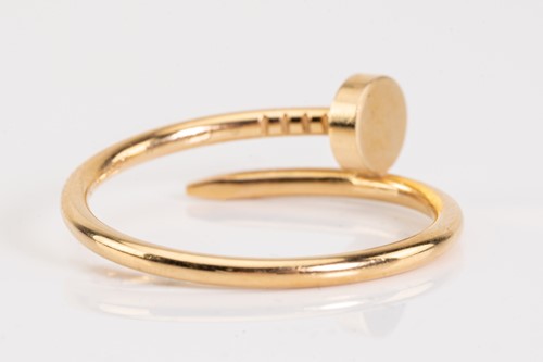 Lot 86 - Cartier - a Juste en Clou ring in 18ct yellow...
