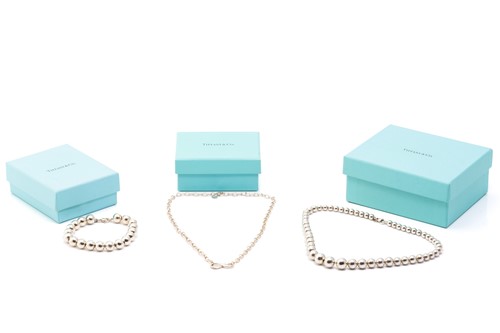 Lot 127 - Tiffany & Co. A silver graduated ball necklace,...