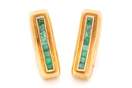 Lot 314 - A pair of emerald clip-on earrings, of...