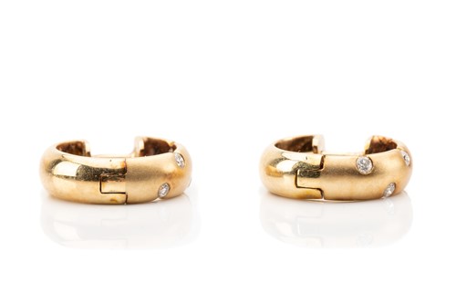 Lot 19 - A pair of diamond set huggy hoop earrings,...